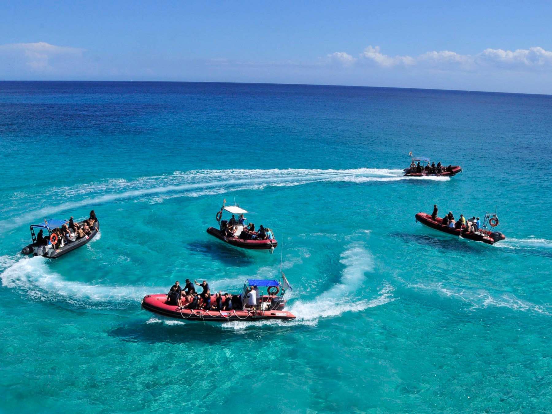 a group of people on a boat in the water